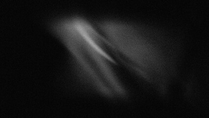Abstract blurred grainy black and white, light gray and black spots.