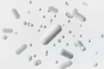 Floating white capsules and spheres create a clean, modern visual effect on a light background