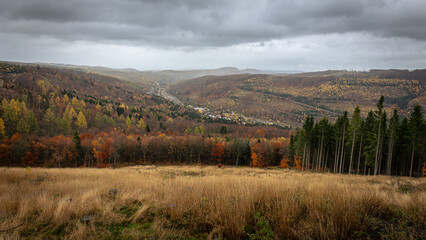 Hiking in Germany in the Sauerland region in the state of North Rhine-Westphalia, on the hills of the Rothaarsteig in November with beautiful autumn colours