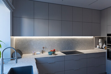 Modern kitchen in modern style with grey furniture, kitchen sink and countertop with induction hob. New apartment with contemporary interior. Nobody.