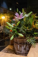 Rustic Flower Arrangement in Wooden Bucket © Anastasya