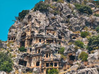Rock-cut tombs of the ancient Lycian necropolis. Myra is an antique town in Lycia where the small town of Kale (Demre) Turkey. Close-up of rock cut tomb grave.