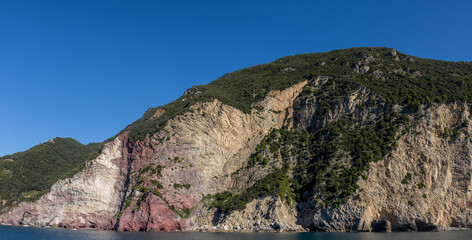Panoramic view of the Ligurian coast and the colorful villages of Cinque Terre as seen from the sea on a cruise ship on a clear day. Cinque Terre, Liguria, Italy