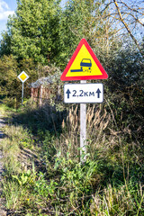Loose gravel road sign. Traffic sign varning for stone damage