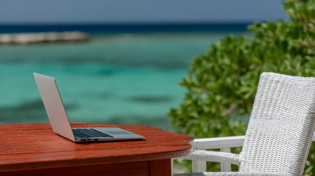 A laptop rests on a sunlit wicker chair near azure waves, epitomizing Digital Nomad Day tranquility and remote productivity - Powered by Adobe