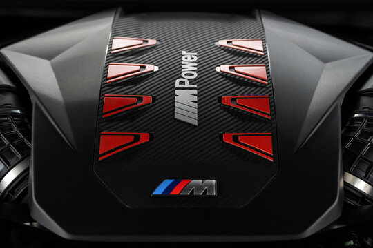 BMW BMW X7 G07 M60i engine - hybrid, plug-in V8 engine. Engine motor M POWER of BMW XM 50e close-up with emblem. BMW sport engine or motor under vehicle hood.