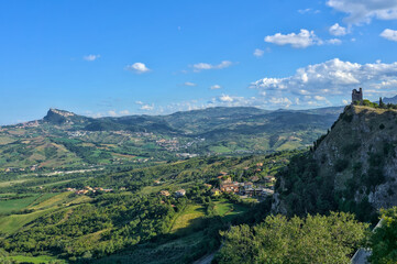 Aerial view of winding country roads, rolling green hills, and farmlands in Emilia Romagna near Torriana.