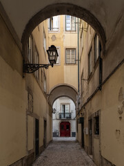 Lisbon street alleyway leading to residential building