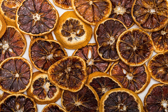 Dried orange slices overhead on white