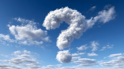 Cumulus formation shapes itself into a large punctuation mark against a bright blue sky