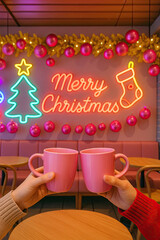 Two people clinking pink mugs in cozy caf&eacute; with Merry Christmas neon