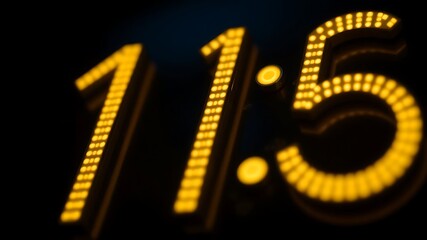 Fototapeta premium Close-up of digital clock numbers glowing in the dark