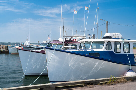 Lobster fishing boats tied up at the wharf in rural Prince Edward Island, Canada.