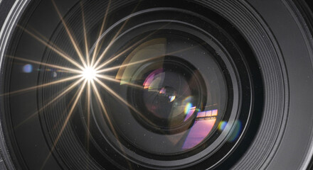 Stunning camera lens with vibrant starburst flare perfect for photography enthusiasts and capturing memorable moments with professional gear