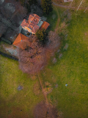 Aerial View of Serene Estate: An expansive estate, with its terracotta roof and meticulously manicured grounds, radiates a sense of peace and opulence.