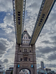 Stunning aerial view of Tower Bridge in London, spanning the River Thames with the city skyline in the background &mdash; blending historic architecture and modern urban beauty. London Bridge