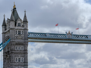 Stunning aerial view of Tower Bridge in London, spanning the River Thames with the city skyline in the background &mdash; blending historic architecture and modern urban beauty. London Bridge