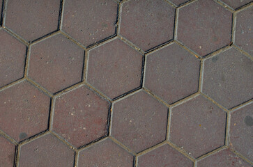 Intriguing red hexagon pavers creating a modern geometric surface design for backgrounds, textures, or stylish architectural elements