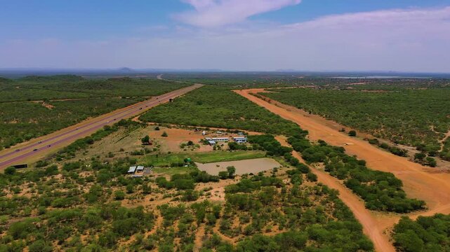 aerial view, Botswana, rural area with road and bush and buildings , daytime, in Odi village