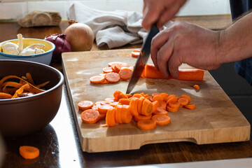 chef cutting carotts