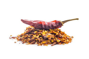 Red chili peppers flakes. Milled spicy peppers and dried chili isolated on white background.