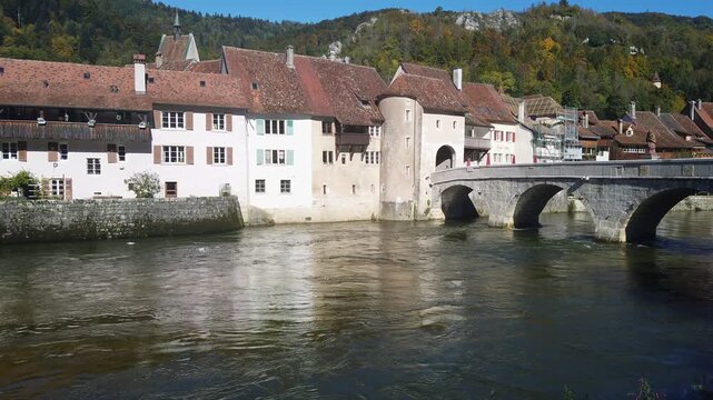 Old town of Saint Ursanne on the Doubs River with the Saint John Nepomucene bridge