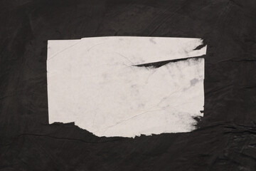 Torn, ripped paper pieces blot crack crumble frame. Black and white copy space texture poster background.