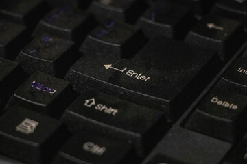 Close up photo of keyboard keys with focus on the Enter button