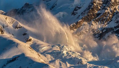Stunning avalanche rushes down snowy mountain slopes