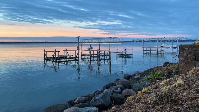 Colorful Sunset Over Lake with Boat Lifts in the Fall