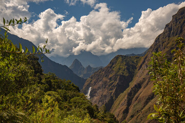 A waterfall in front of the Machu Picchu valley seen from the Salkantay trail in Peru