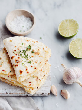 Mexican quesadilla with lime, garlic, white cheese and salt