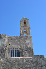 Exterior view of the historic Byzantine-era St. Nicholas Church ,Noel Baba Church, with its stone walls and bell tower, located in Demre, Antalya, Turkey.