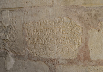 Antique writing on the wall in Church of St. Nicholas, holy places and landmarks of Demre in Turkey.