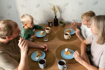 Family enjoying breakfast together around a table
