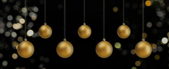 Golden Christmas balls against blurred lights on black background, bokeh effect. Banner design