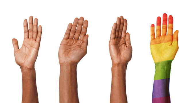 Men raising hands on white background, closeup. Arm in colors of LGBT flag