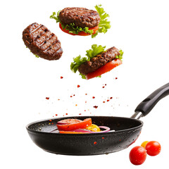 frying pan with cutlets and tomatoes  in the air  without background isolated