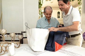 Father and son of Latin descent enjoying shopping together