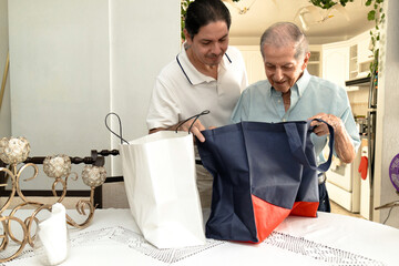 Father and son of Latin descent enjoying shopping together