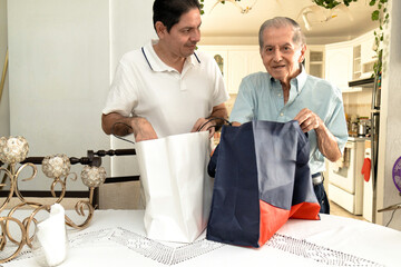 Father and son of Latin descent enjoying shopping together