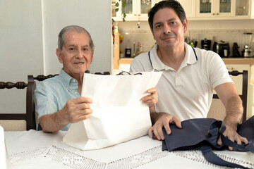 Father and son of Latin descent enjoying shopping together