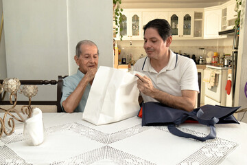 Father and son of Latin descent enjoying shopping together