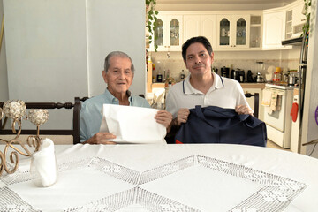 Father and son of Latin descent enjoying shopping together
