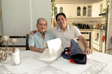 Father and son of Latin descent enjoying shopping together