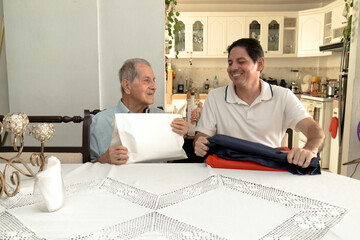 Father and son of Latin descent enjoying shopping together