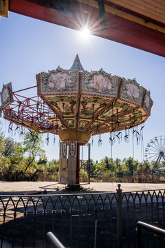 Overgrown roller coaster and decaying rides at abandoned New Orleans amusement park