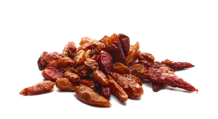Close up dried bird's eye chili peppers pile isolated on white background, side view	