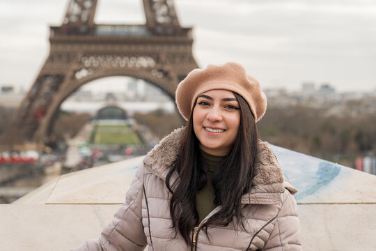 Winter Paris portrait of girl in front of Eiffel Tower