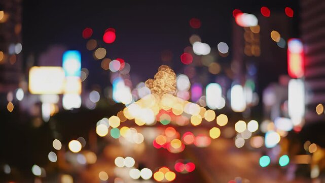 Abstract city street at night with kaleidoscope of lights, capturing the dynamic concept of urban energy and perfect for commercial applications requiring a vibrant, technological atmosphere.